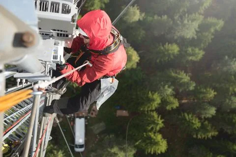 Technician Working at Height on a 5g Telecom Tower Foto stock