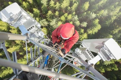 Technician Working at Height on a 5g Telecom Tower 写真素材