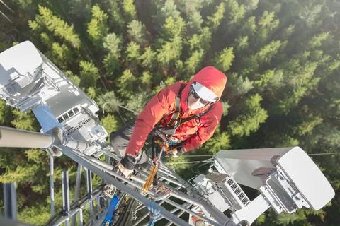 Technician Working at Height on a 5g Telecom Tower 写真素材