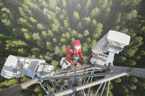 Technician Working at Height on a 5g Telecom Tower 写真素材