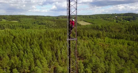 Technician Working at heights on a 5G Antenna Stock Footage 233593353