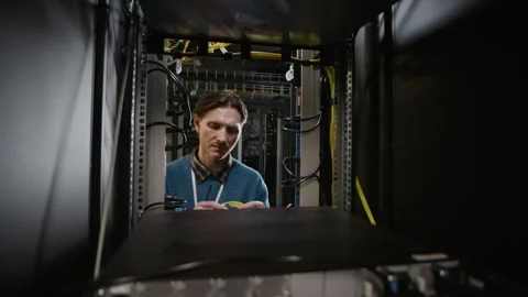 Technician Working Inside Data Center Server Cabinet Stock Footage 330542114
