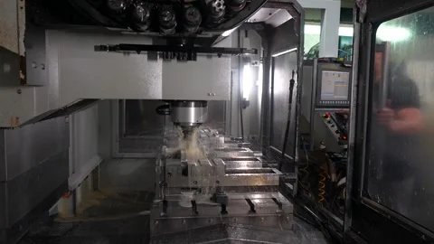 Technician working with milling machine in a cnc factory Stock Footage 293320614