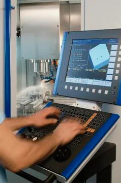 Technician working with a milling machine Stock Photos