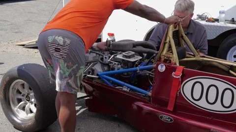 Technician is working on opened wheel racing car. Видео 157791191