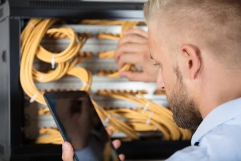 Technician Working On Server In The Data Center Stock Photos