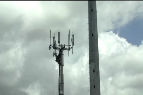 Technician working on top of cellular antenna tower 3 Stock Footage 773733