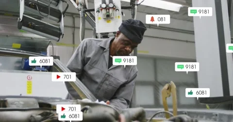 Technician working under hood in garage, notifications appearing over engine Stock Footage 331109286