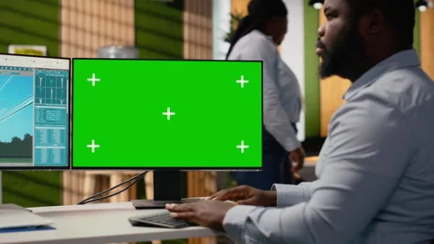 Technician works on power line tower CAD design on green screen PC in office Stock Footage 315612473