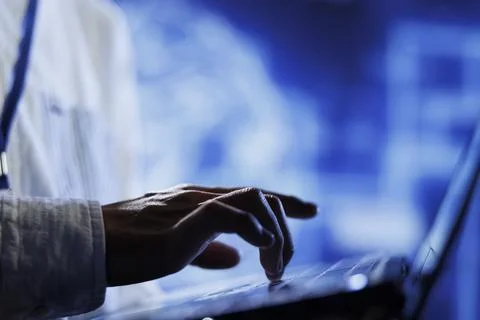 Technician writes AI code on laptop Stock Photos