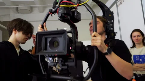 Technicians adjust steadicam balance with small tools 動画素材 308951844