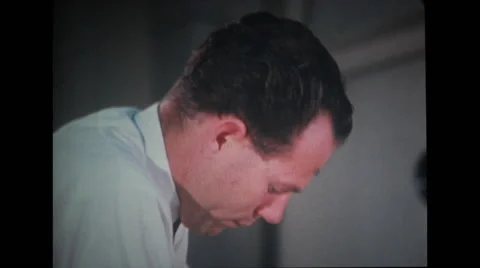 Technicians adjusting and assisting astronaut Stock Footage 37597123