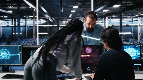 Technicians in AI server hub panicked by hacking attempt stealing company data Stock Footage 313566282