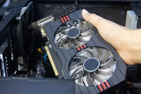 Technicians are assembling graphics cards, computer components. Stock Photos