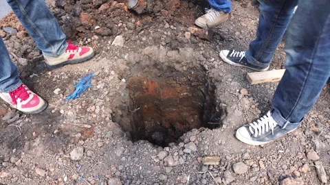 Technicians are digging holes to install high-voltage power poles Stock Footage 248162799