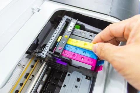 Technicians are install setup the ink cartridge or inkjet cartridge Stock Photos