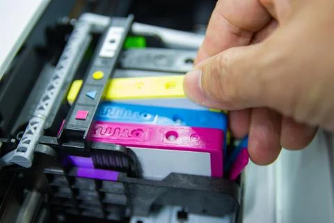 Technicians are install setup the ink cartridge of a inkjet printer Stock Photos