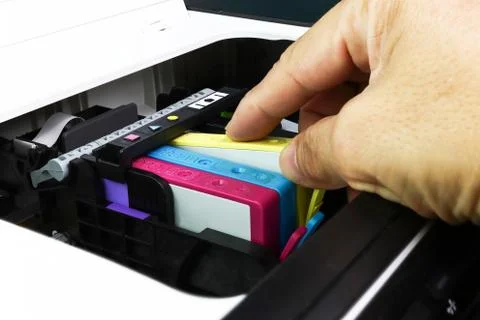 Technicians are install setup the ink cartridge of a inkjet printer Stock Photos