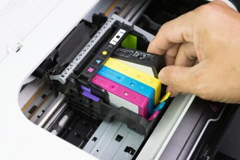 Technicians are install setup the ink cartridge of a inkjet printer 스톡 사진