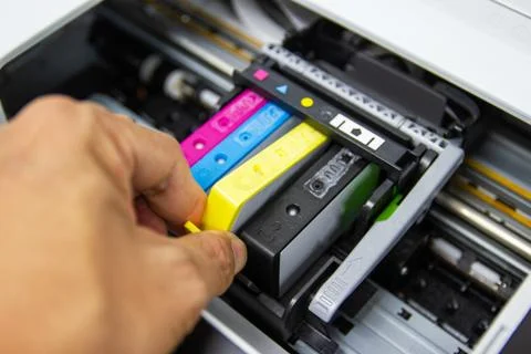Technicians are installing the color printer inkjet cartridge Stock Photos