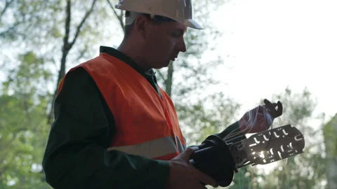 Technicians are installing optic fiber with cable ties. Stock Footage 89228512