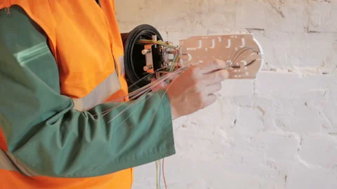 Technicians are installing optic fiber with cable ties. Stock Footage 89233546