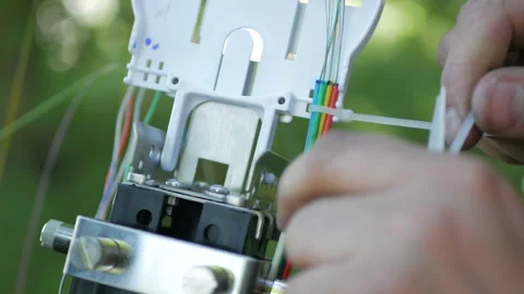Technicians are installing optic fiber with cable ties. Stock Footage 89680754