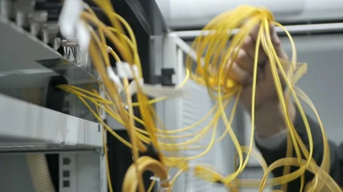 Technicians are installing optic fiber with cable ties. Stock Footage 97753124