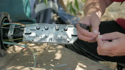 Technicians are installing optic fiber with cable ties. Stock Footage 112196308