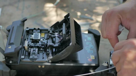 Technicians are installing optic fiber with cable ties. Stock Footage 112244200