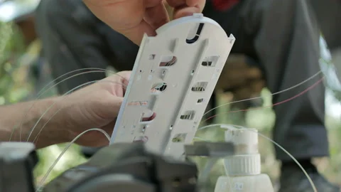 Technicians are installing optic fiber with cable ties. Stock Footage 150092109