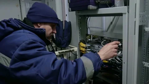 Technicians are installing optic fiber with cable ties. Stock Footage 151038988