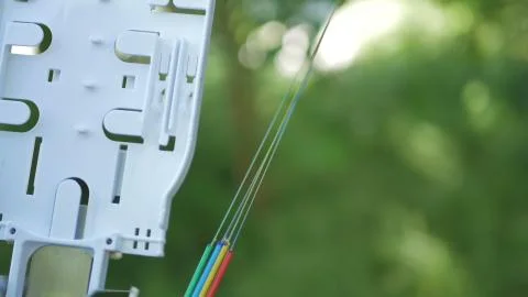 Technicians are installing optic fiber with cable ties. Stock Photos