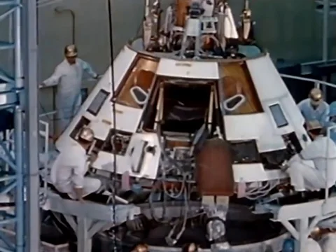 Technicians assemble and test an Apollo spacecraft and a launch is shown, in Stock Footage 79458914
