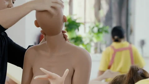 Technicians assembling a realistic female android robot Video stock 333215224