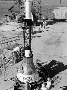 Technicians attach the escape tower to the Mercury capsule prior to assemb... Stock Photos