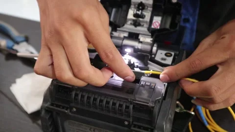 Technicians connecting fiber optic cables for the internet network. Stock Footage 345704002