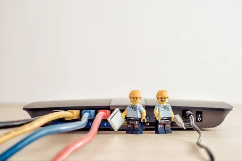 Technicians connecting network cable Stock Photos