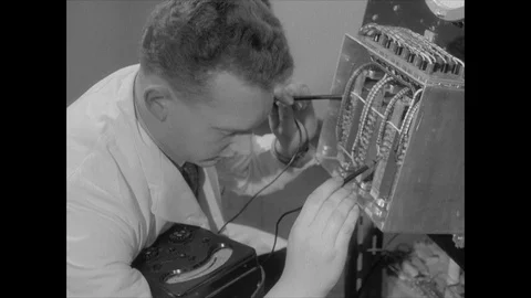 Technicians at controls of telescope, 1957, UK Stock Footage 130677360