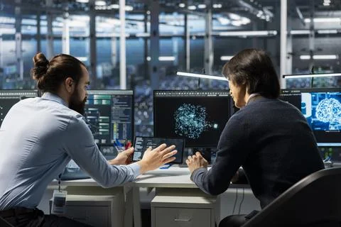Technicians in data center installing upgraded server racks systems helped by AI Stock Photos
