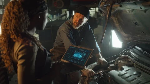 Technicians Discussing Problem With Car Stock Footage 244836246