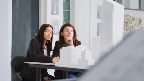 Technicians drawing lines on construction plans draft Stock Photos