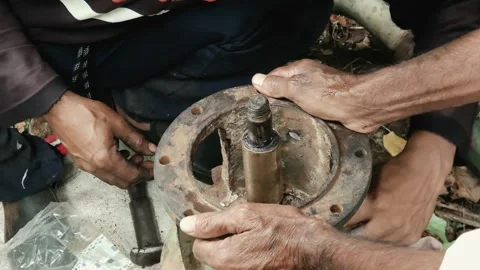 Technicians Fitting a Hex Nut onto a rusted flange bolt of a disassembled centri 動画素材 344850606