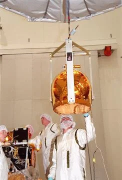 Technicians guide The Gamma Ray Spectrometer (GRS)into place to be Stock Photos