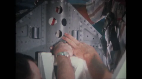 Technicians guiding spacecraft couch into test stand Stock Footage 37597022