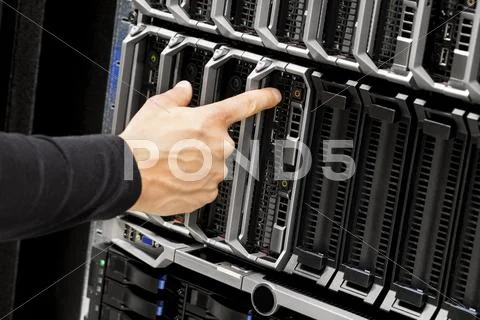 Technicians Hand Touching Blade Server At Data Center Stock Photos