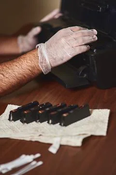 The technician's hands on the printer Stock Photos