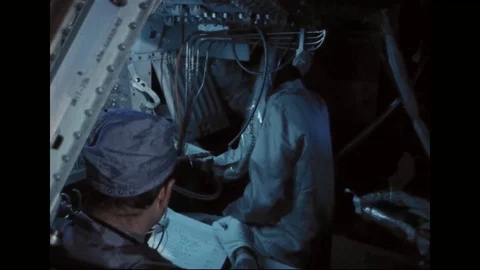 Technicians inside CM 104 during systems test - 1968 Stock Footage 104330936