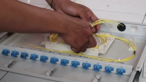 Technicians install fiber optic cables Видео 342909531