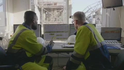 Technicians leaving control room Stock Footage 114346724
